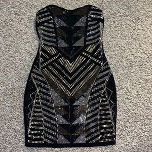 Brand new, never worn. Short petite bedazzled black dress.
